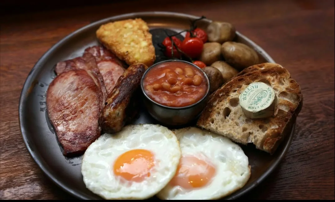 Full breakfast with fried eggs and mushrooms