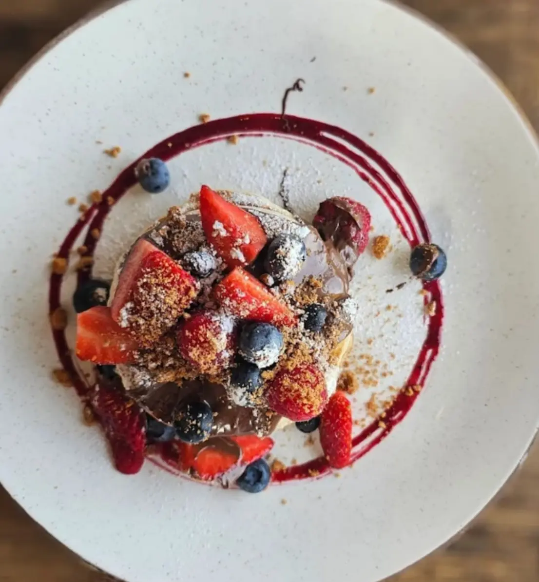 French toast topped with berries and icing sugar